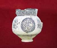 Grooved pottery jug